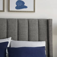 Dark stone wingback bed