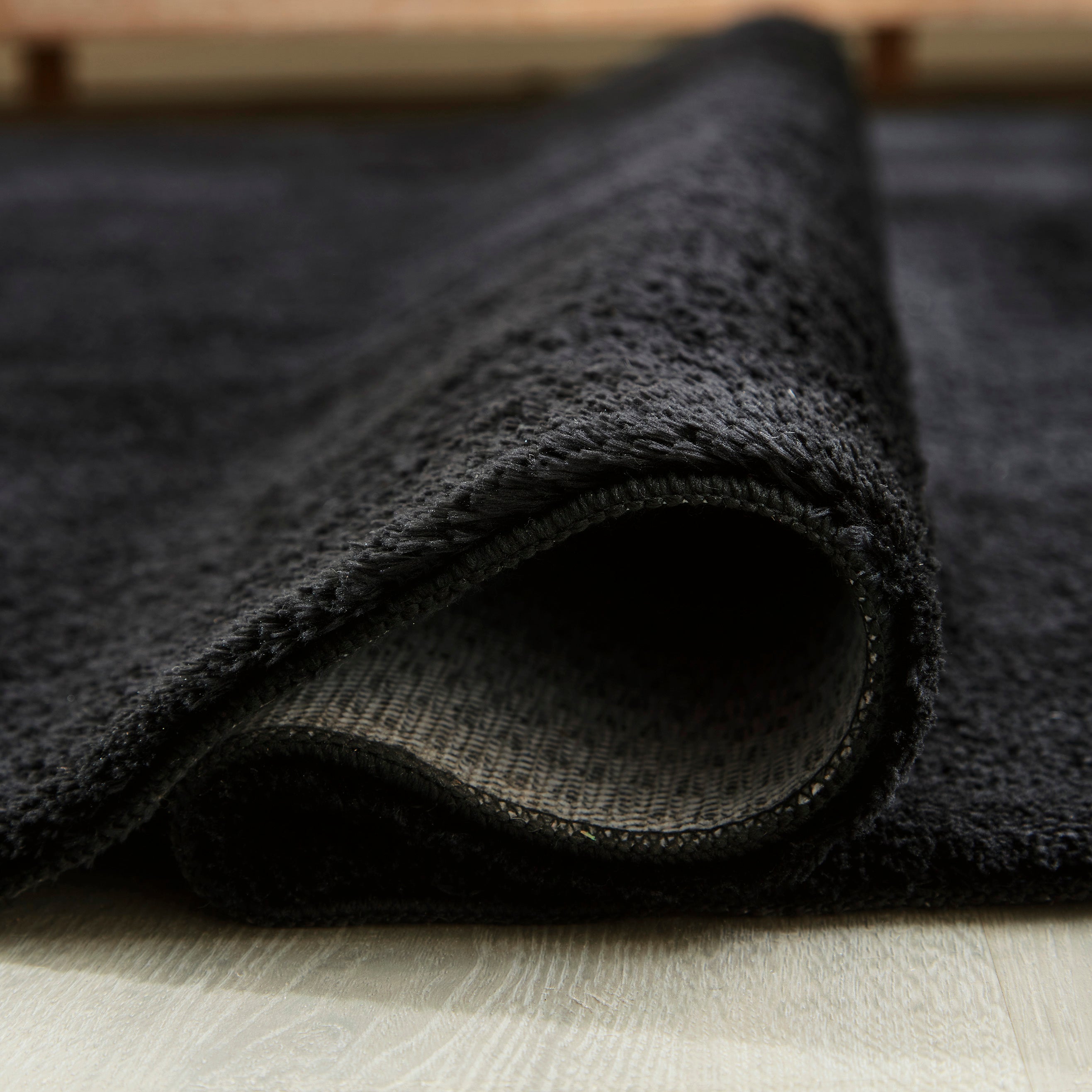 Subtle Textured Solid Black Area Rug
