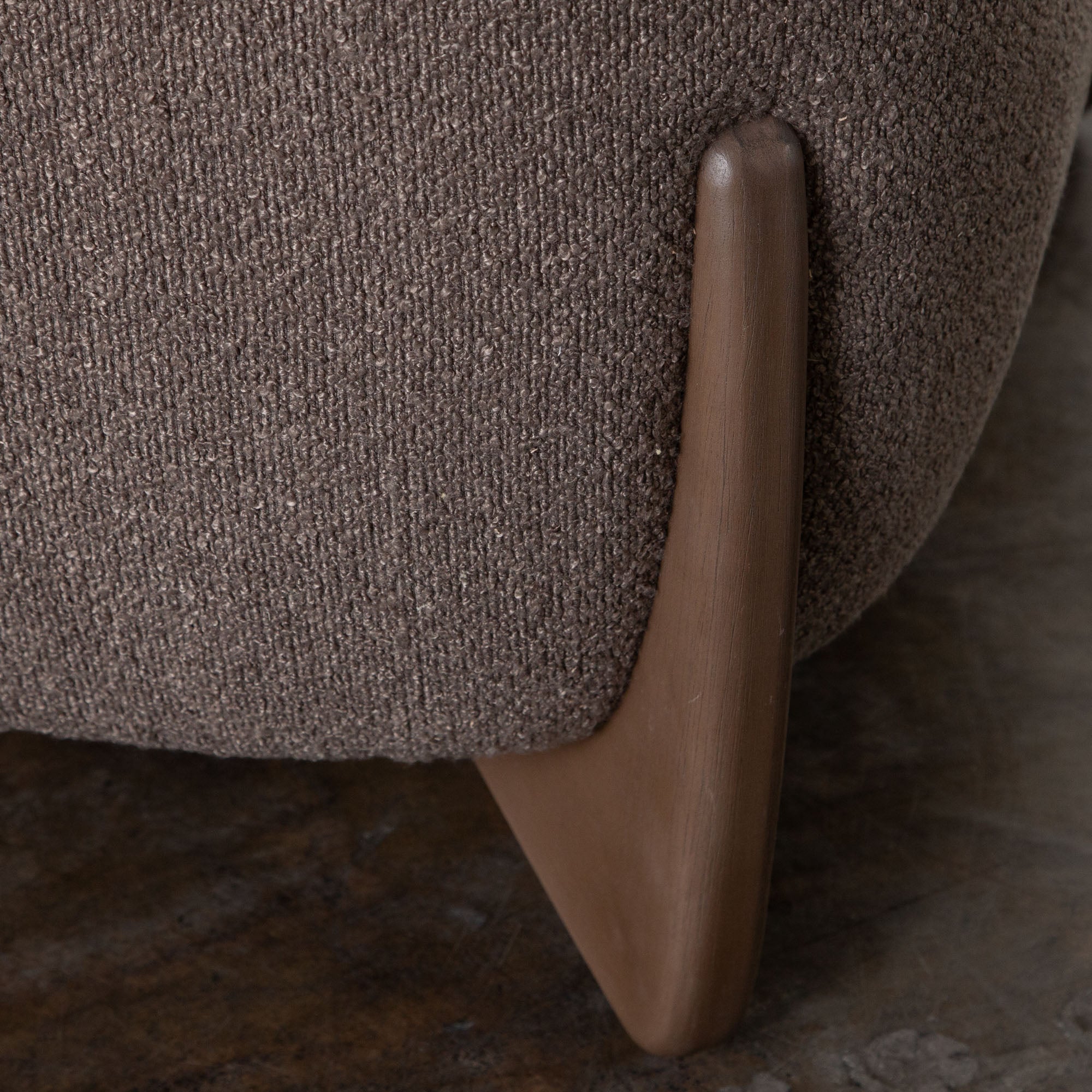 Sculpted solid wood legs on toffee brown sofa