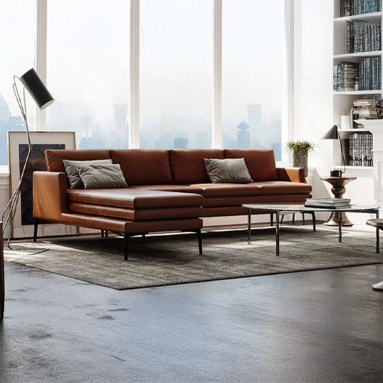Tan leather sectional with left-facing chaise angled view