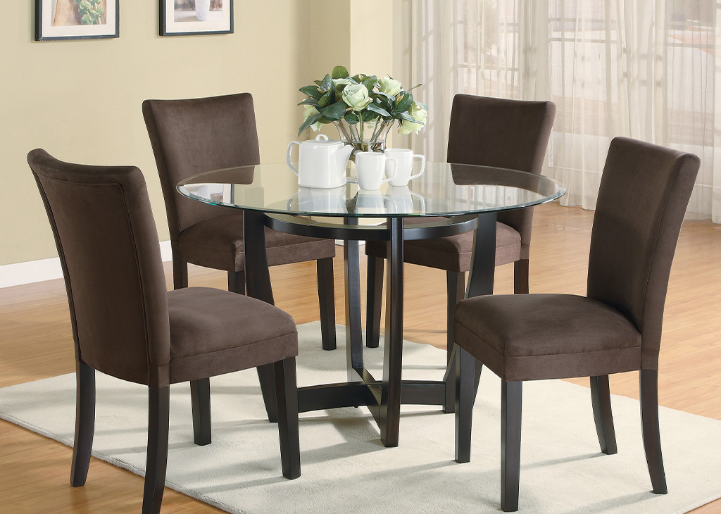 Small glass dining table set with fabric chairs
